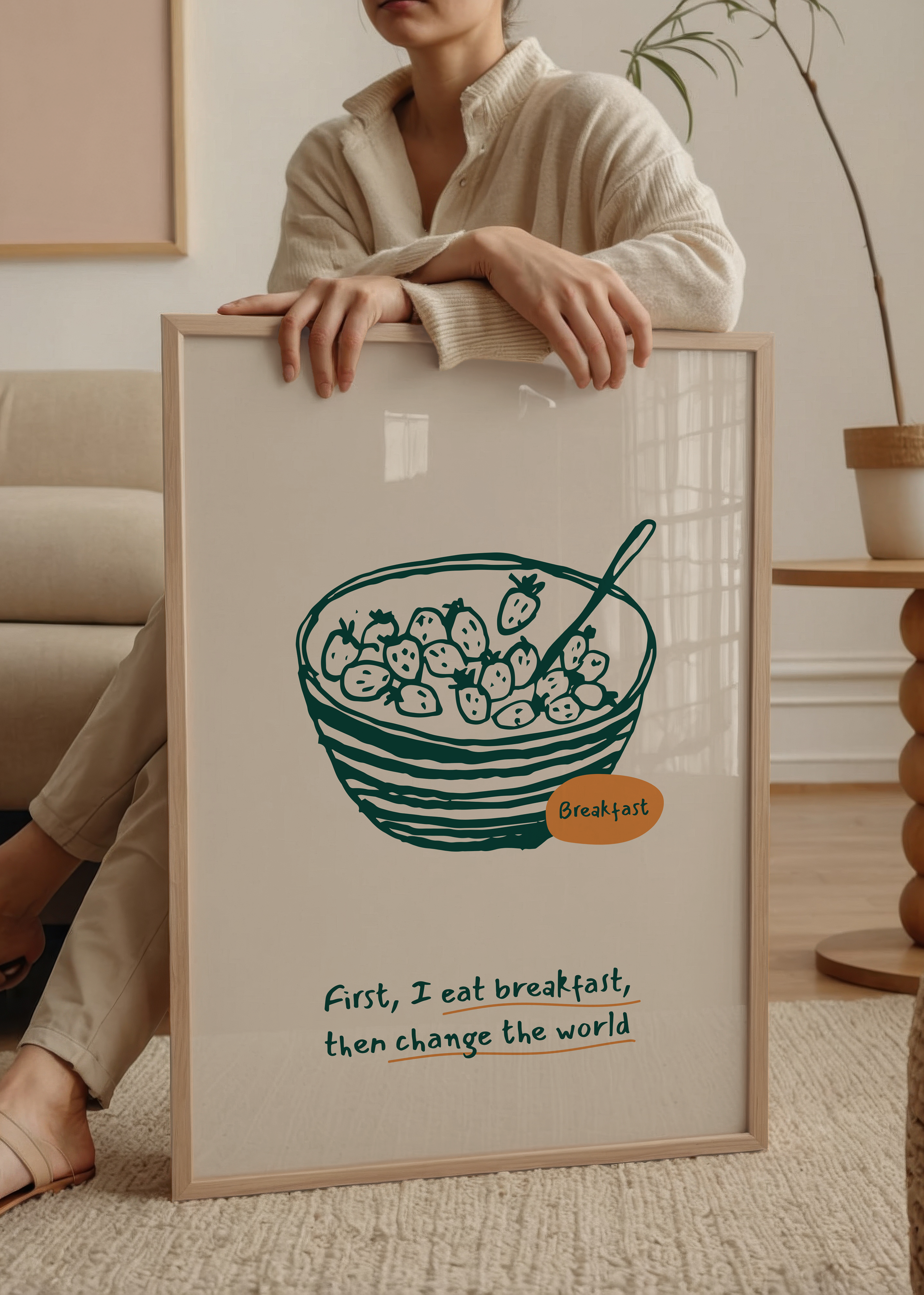 Kahvaltı kasesi illüstrasyonu ve “First I eat breakfast, then change the world” yazılı mutfak posteri