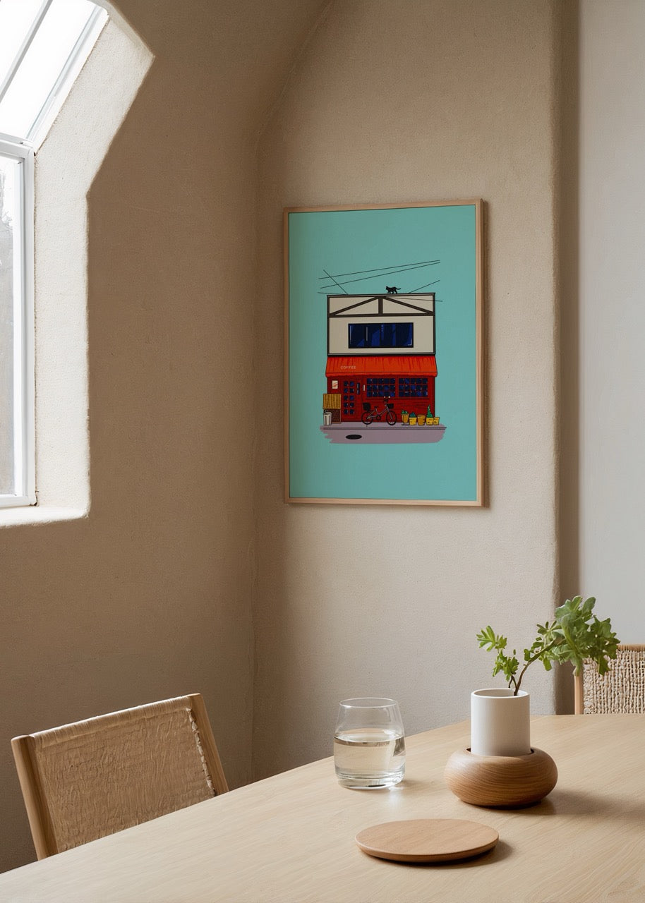 Kırmızı bir kafe binasının çatısında yürüyen siyah kedinin yer aldığı, bisiklet ve sokak detaylarıyla sade bir illüstrasyon.