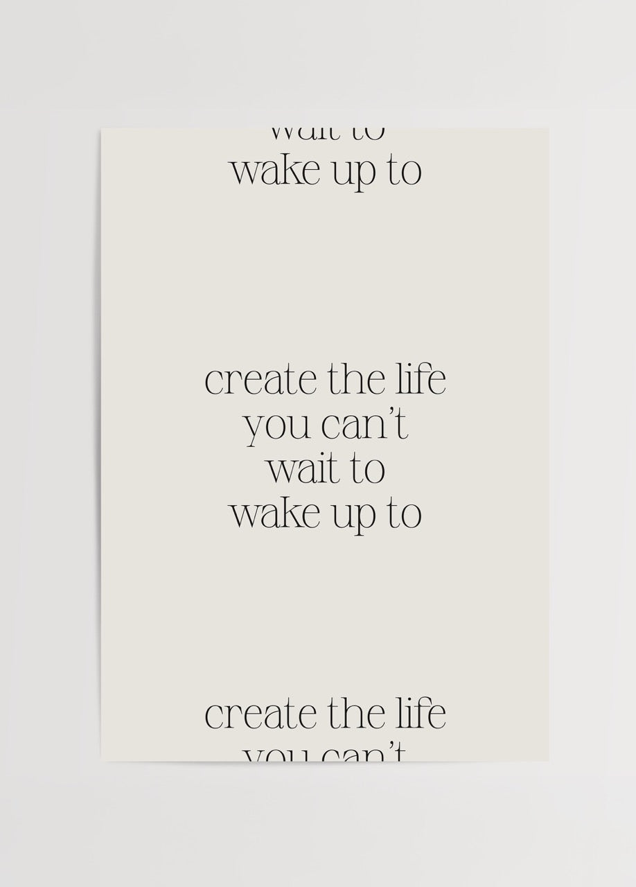Beyaz zemin üzerine “create the life you can’t wait to wake up to” yazılı minimalist motivasyon posteri
