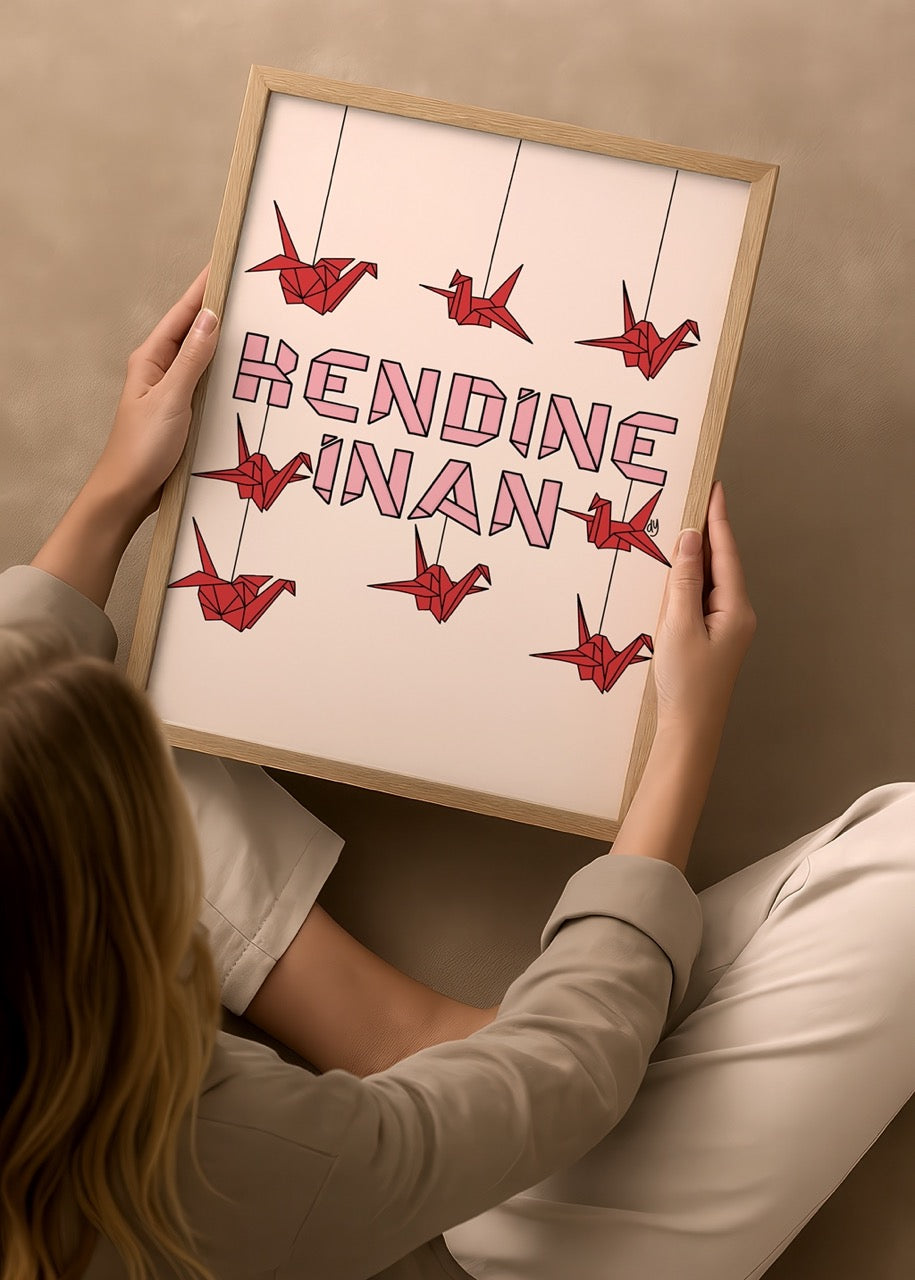 duygulariyerim’in “Kendine İnan” posteri – pembe yazı tipinde güçlü tipografi ve kırmızı origami turnalarla özgüven temalı tasarım