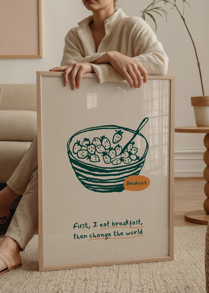 Kahvaltı kasesi illüstrasyonu ve “First I eat breakfast, then change the world” yazılı mutfak posteri