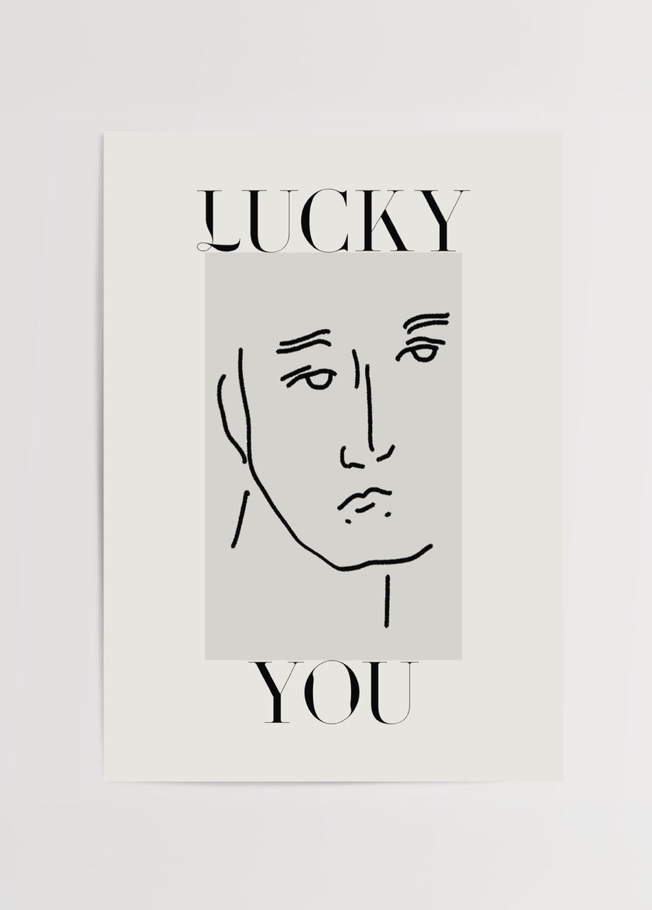 Siyah çizgi yüz illüstrasyonu ve “Lucky You” tipografi tasarımlı minimalist Lucky You Line Art modern duvar posteri.