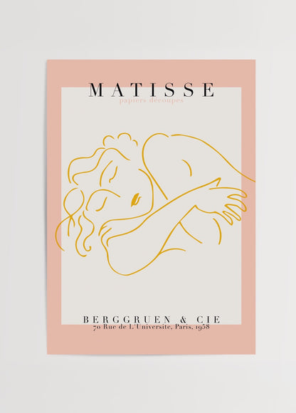 Henri Matisse’in çizgisel bir kadın figürünü betimleyen, pembe kenarlıklı ve “papiers découpés” yazılı modern sanat posteri.